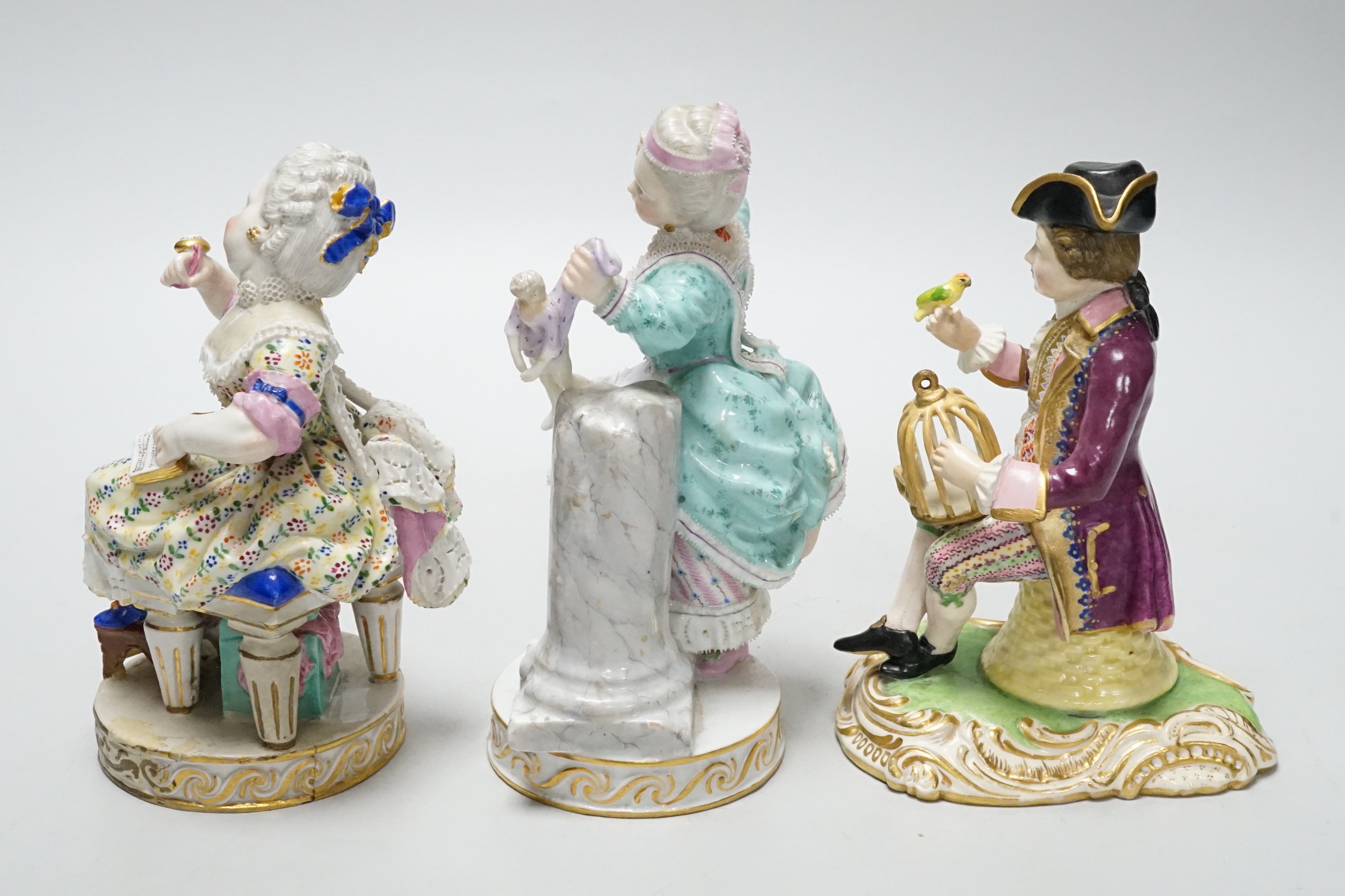 Three Meissen figure groups (with damage), tallest, figurine holding a doll, 15.5cm high